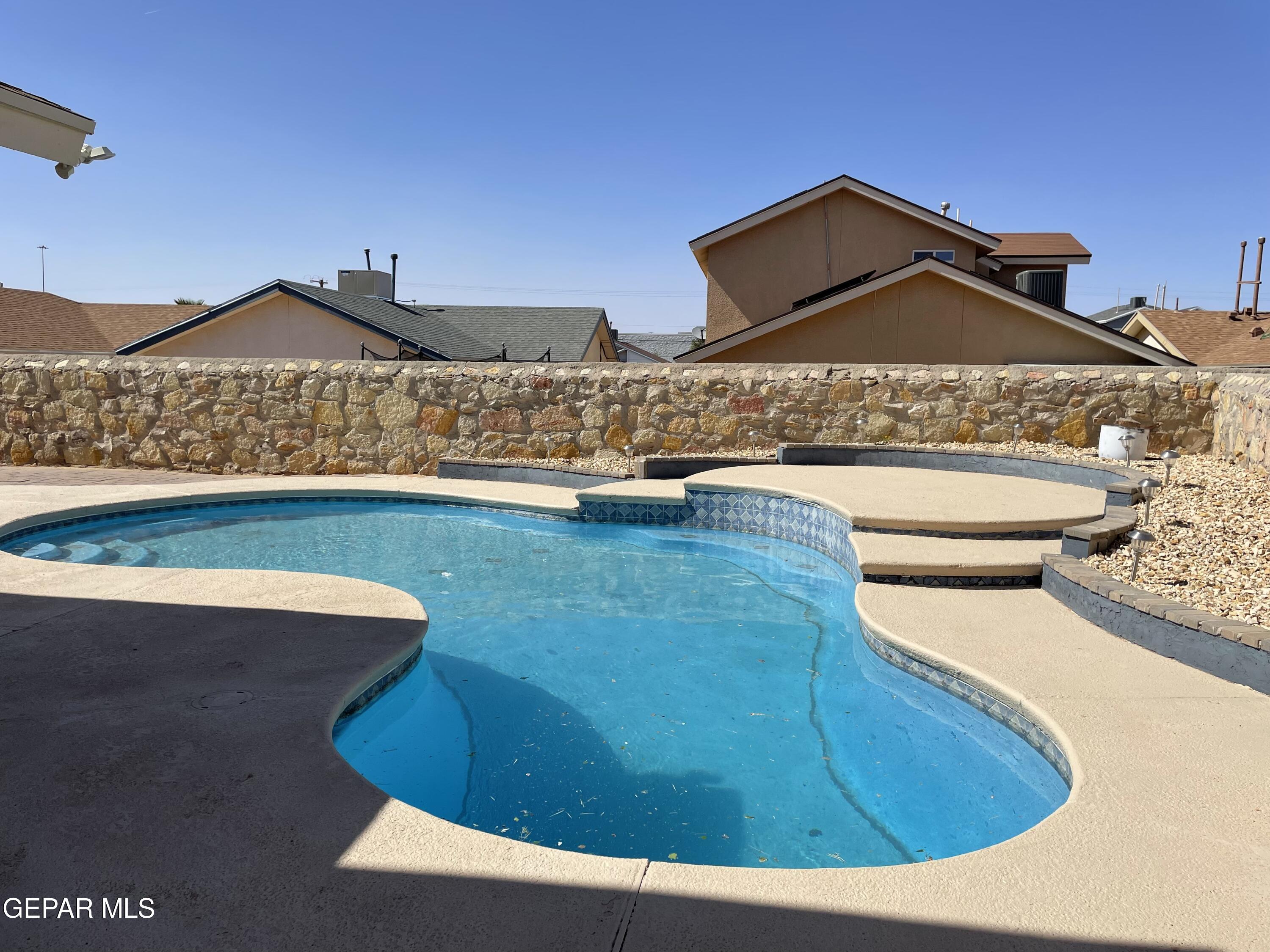 a view of swimming pool from a balcony