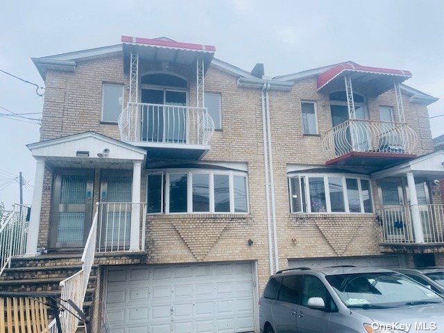 a front view of a house with parking