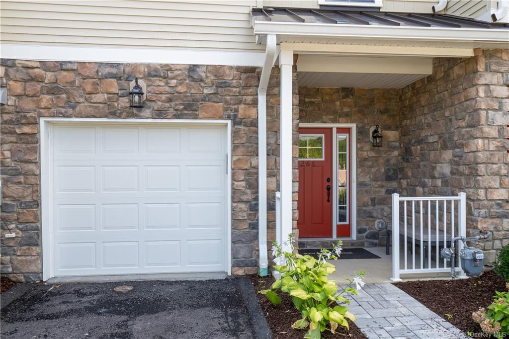 Entrance to property featuring a garage