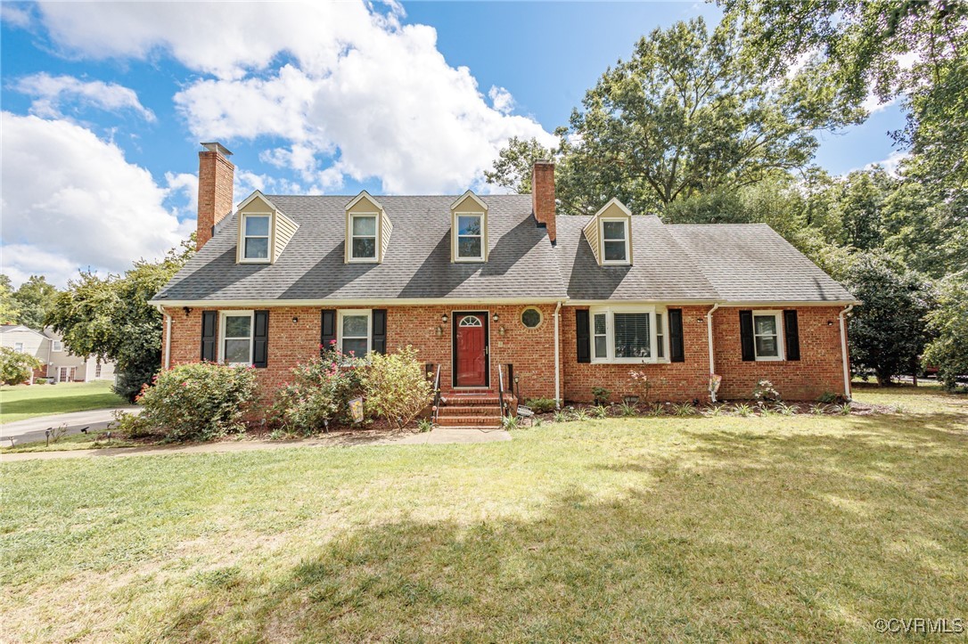 a front view of a house with yard