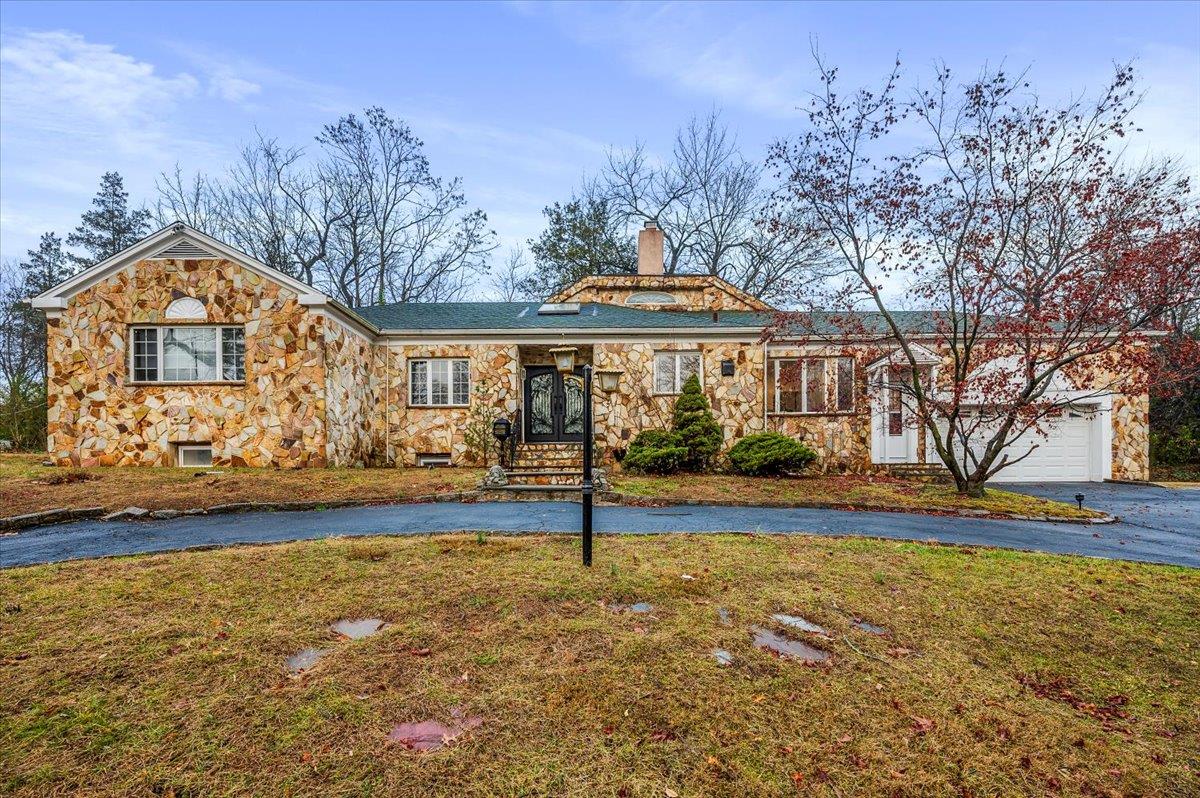 Ranch-style home with a front yard