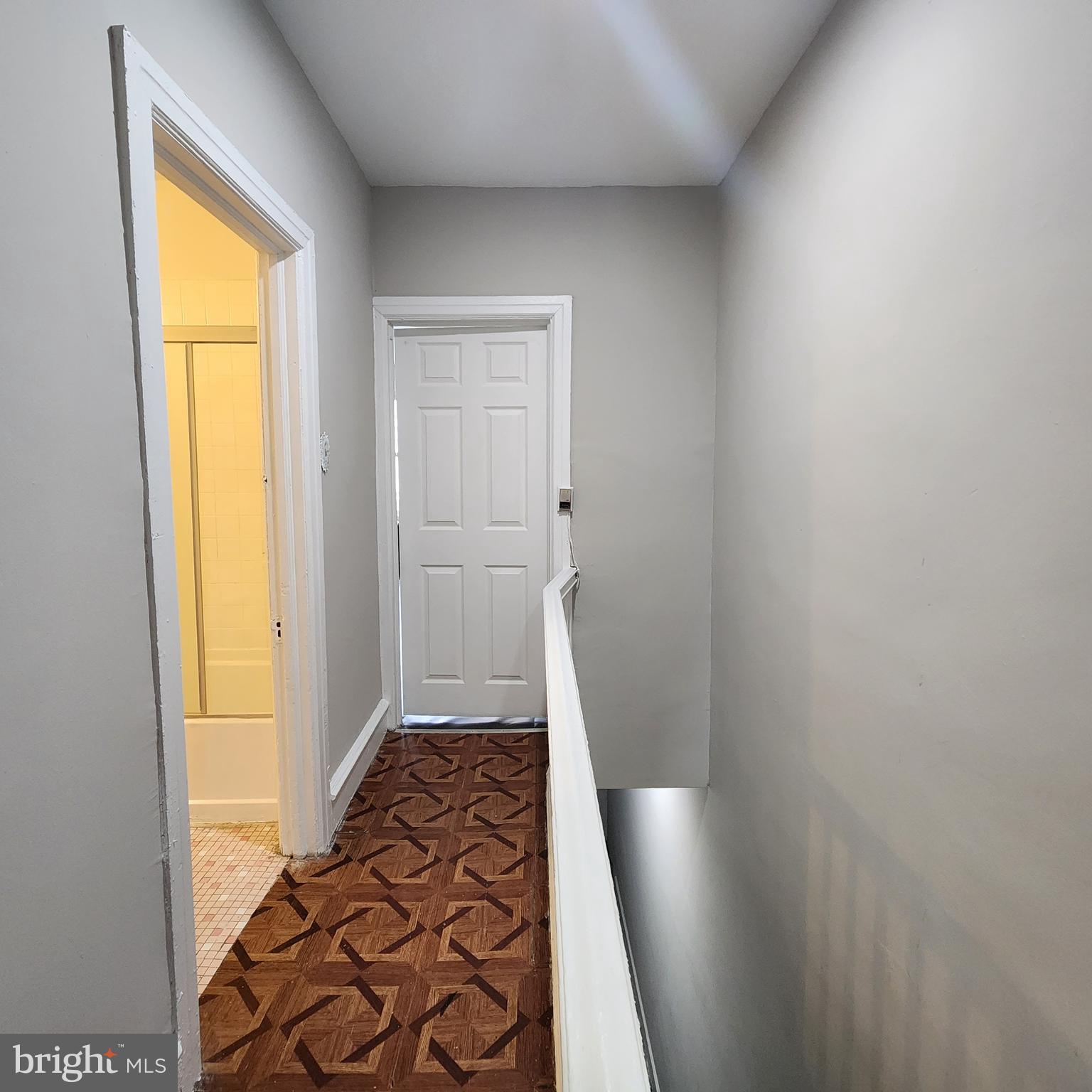 a view of room with window and hallway