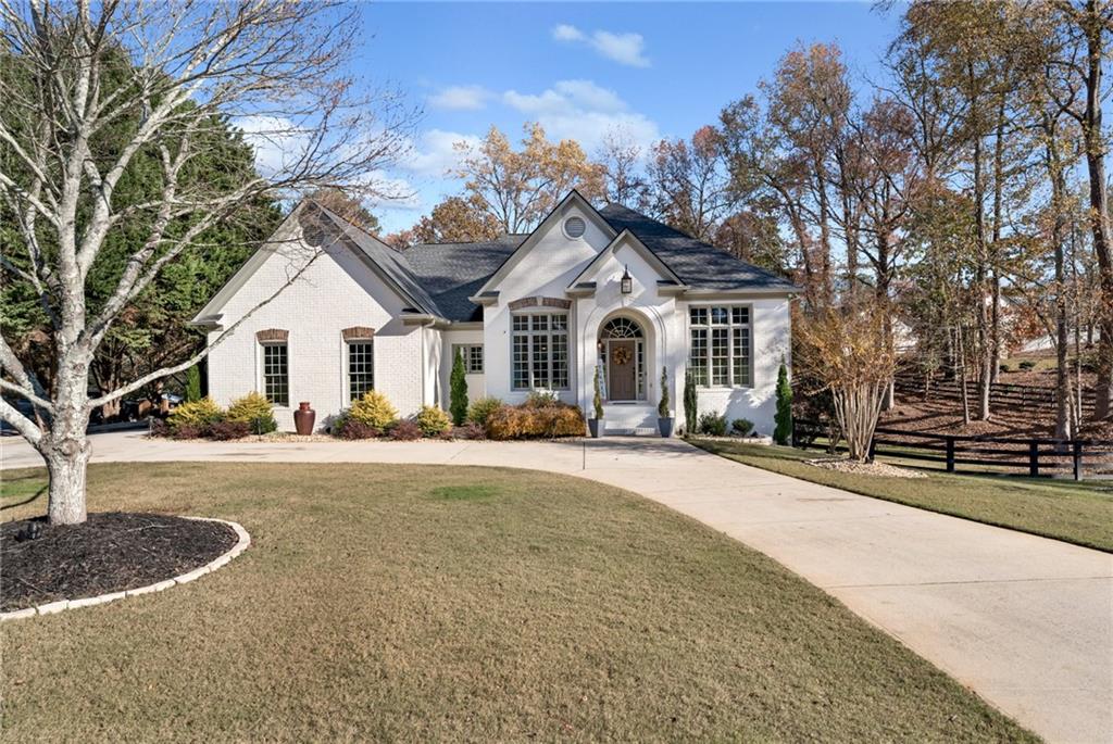 a front view of a house with a yard