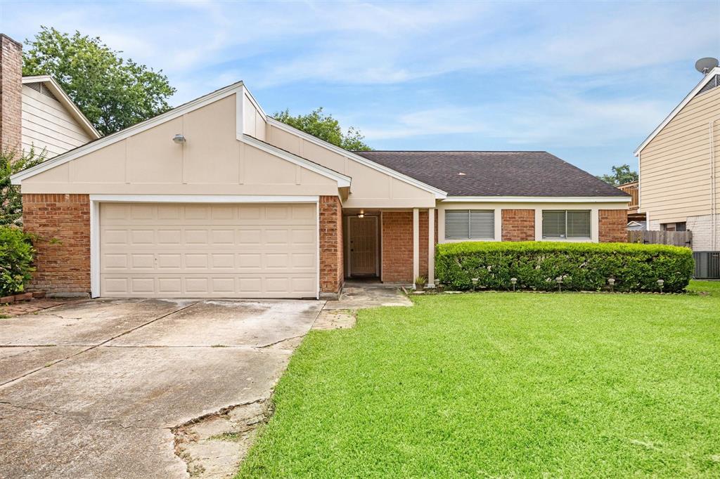 a view of a yard in front view of a house