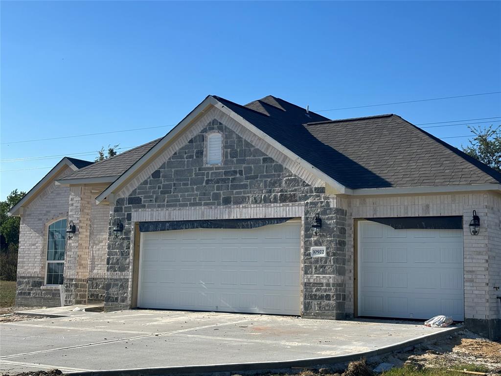 a front view of a house with a garage