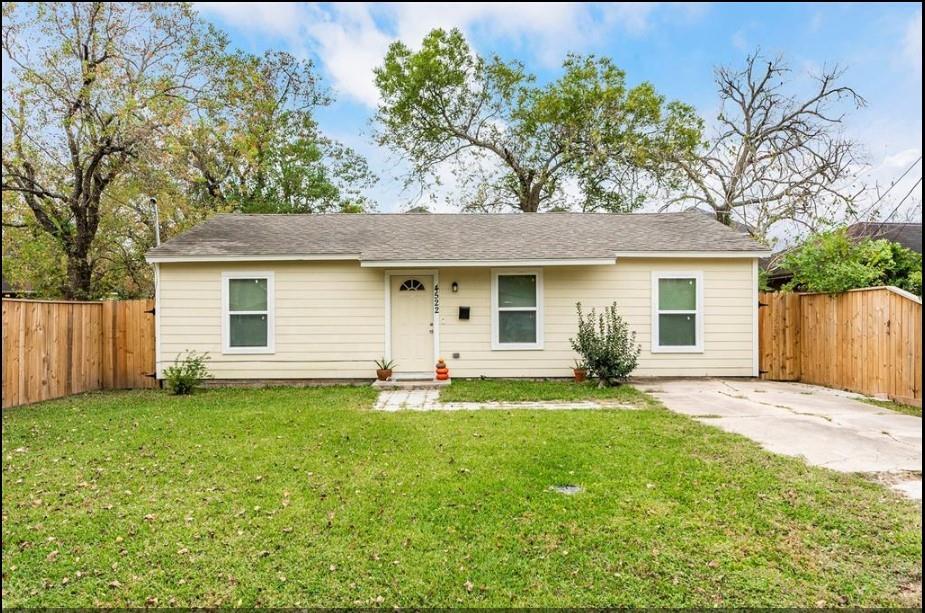 front view of a house with a yard