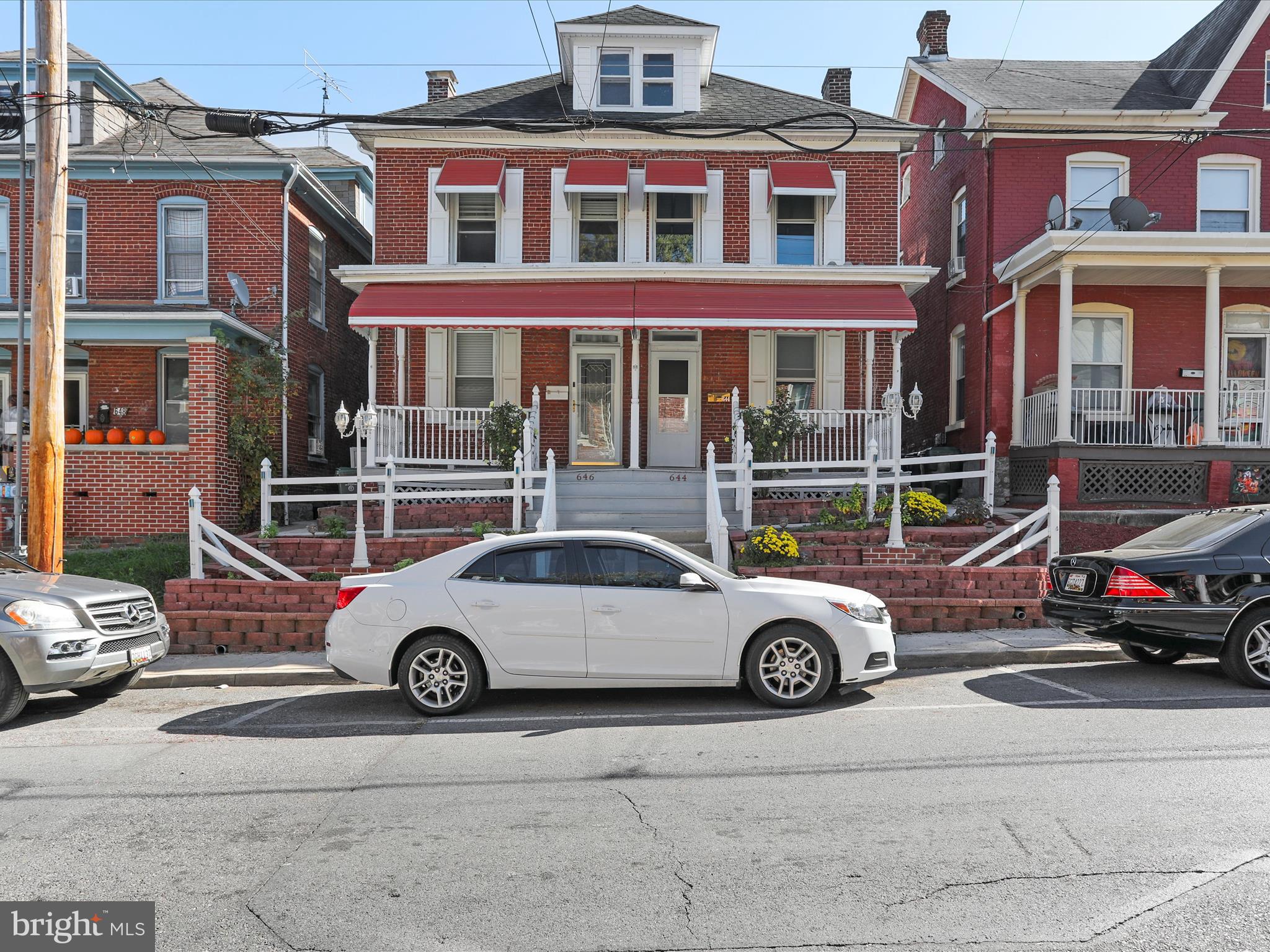 a car parked in front of a house