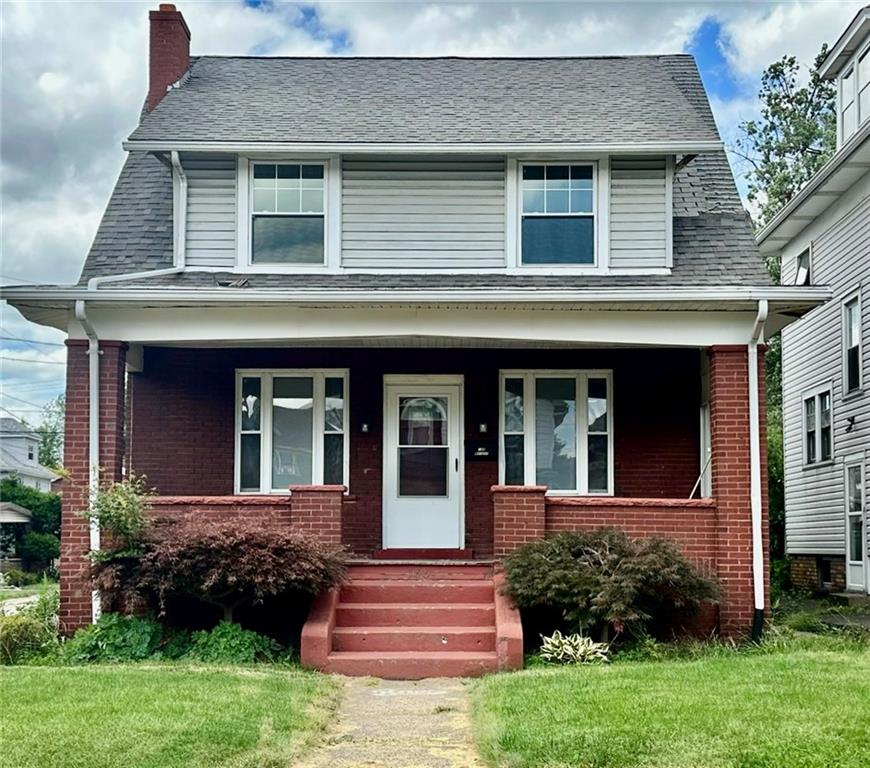 front view of a house with a yard