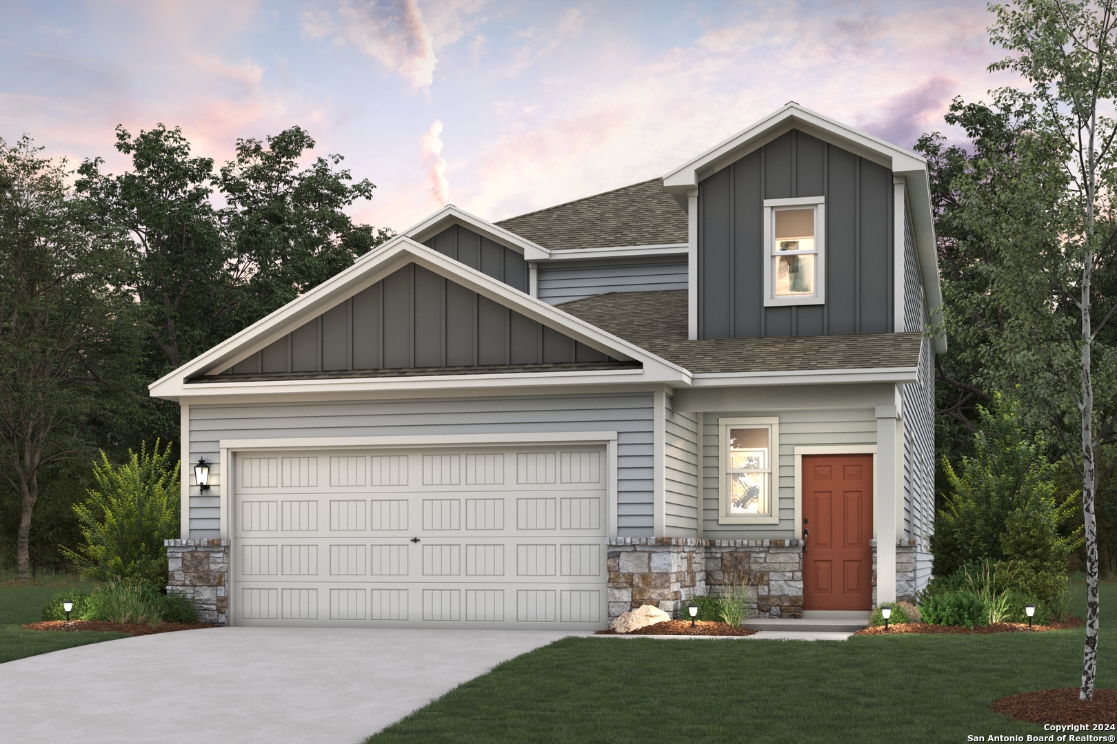 a front view of a house with a yard and garage