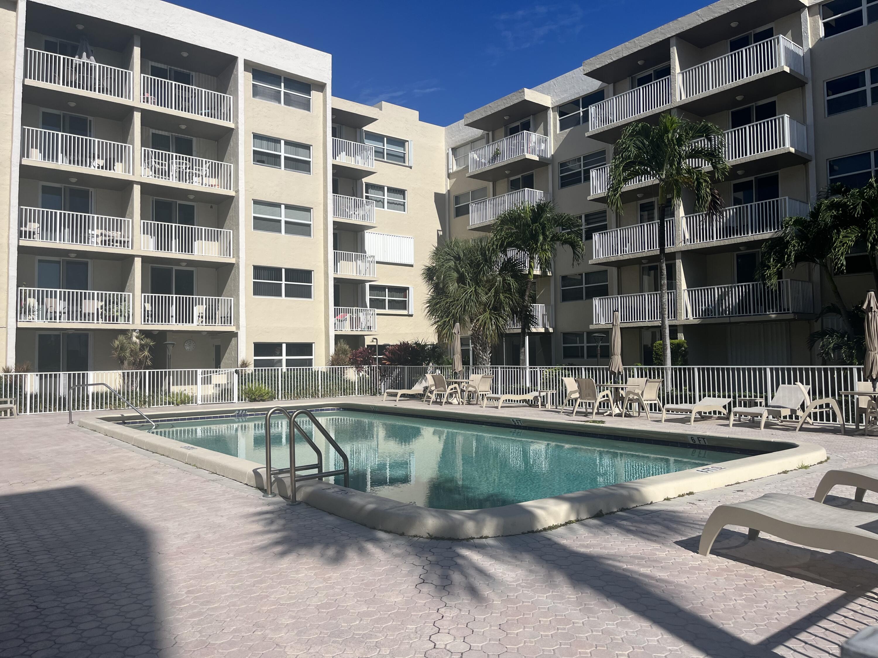 a view of a swimming pool with a patio