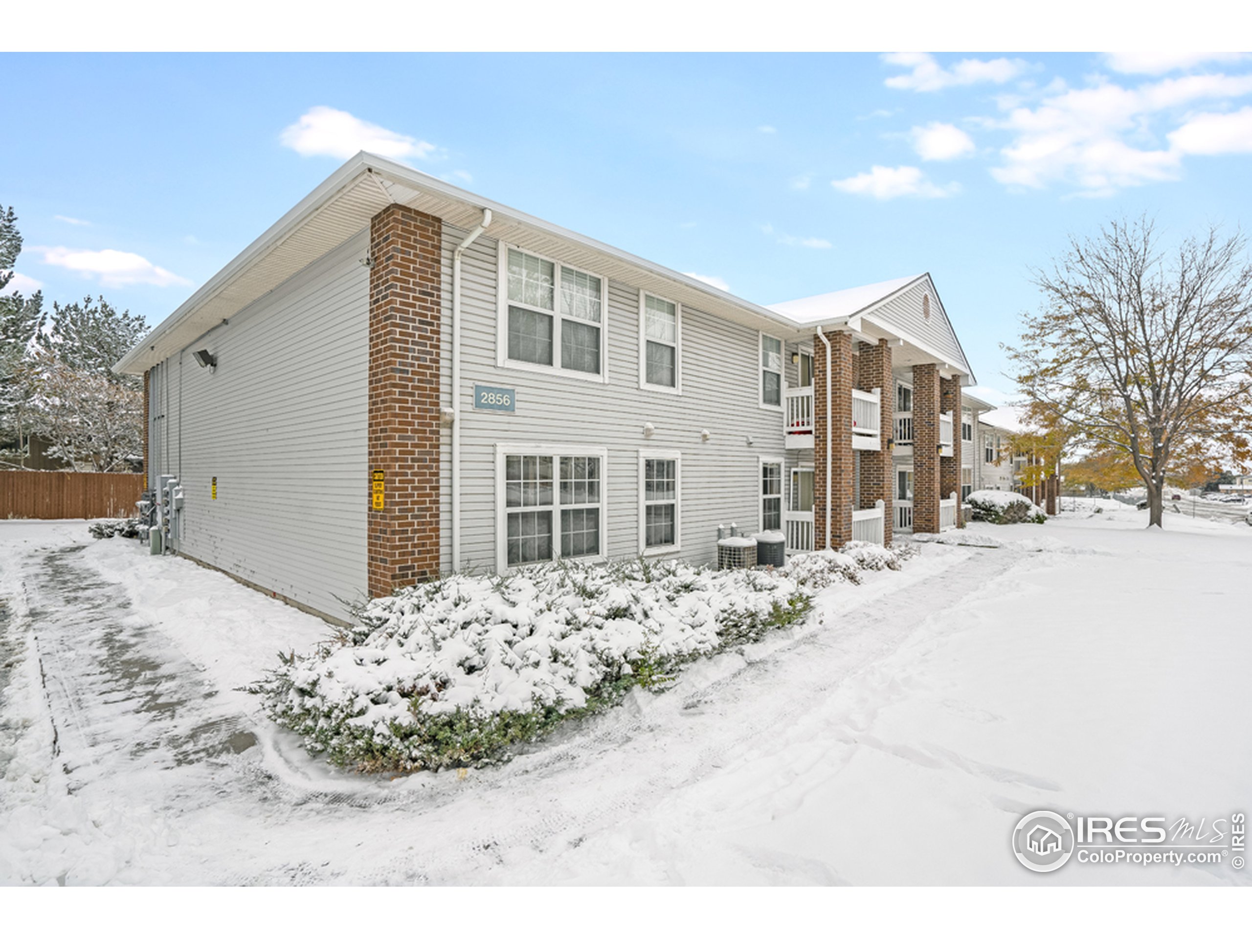 a view of a house with snow on the road