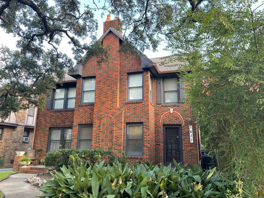 a brick building with large windows