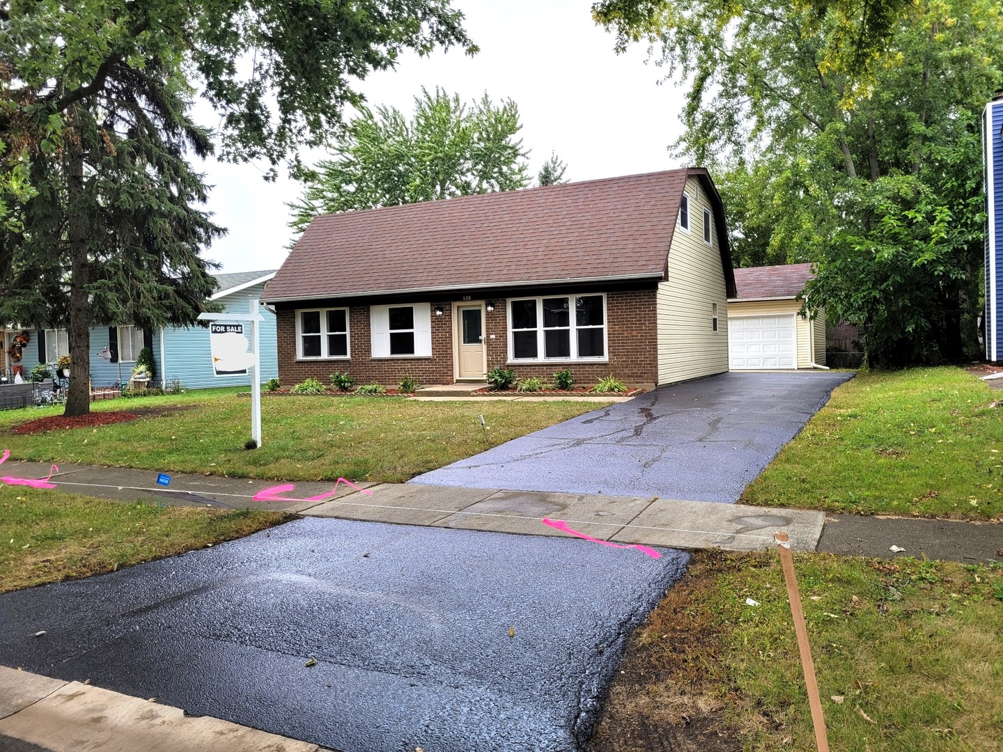 front view of a house with a yard