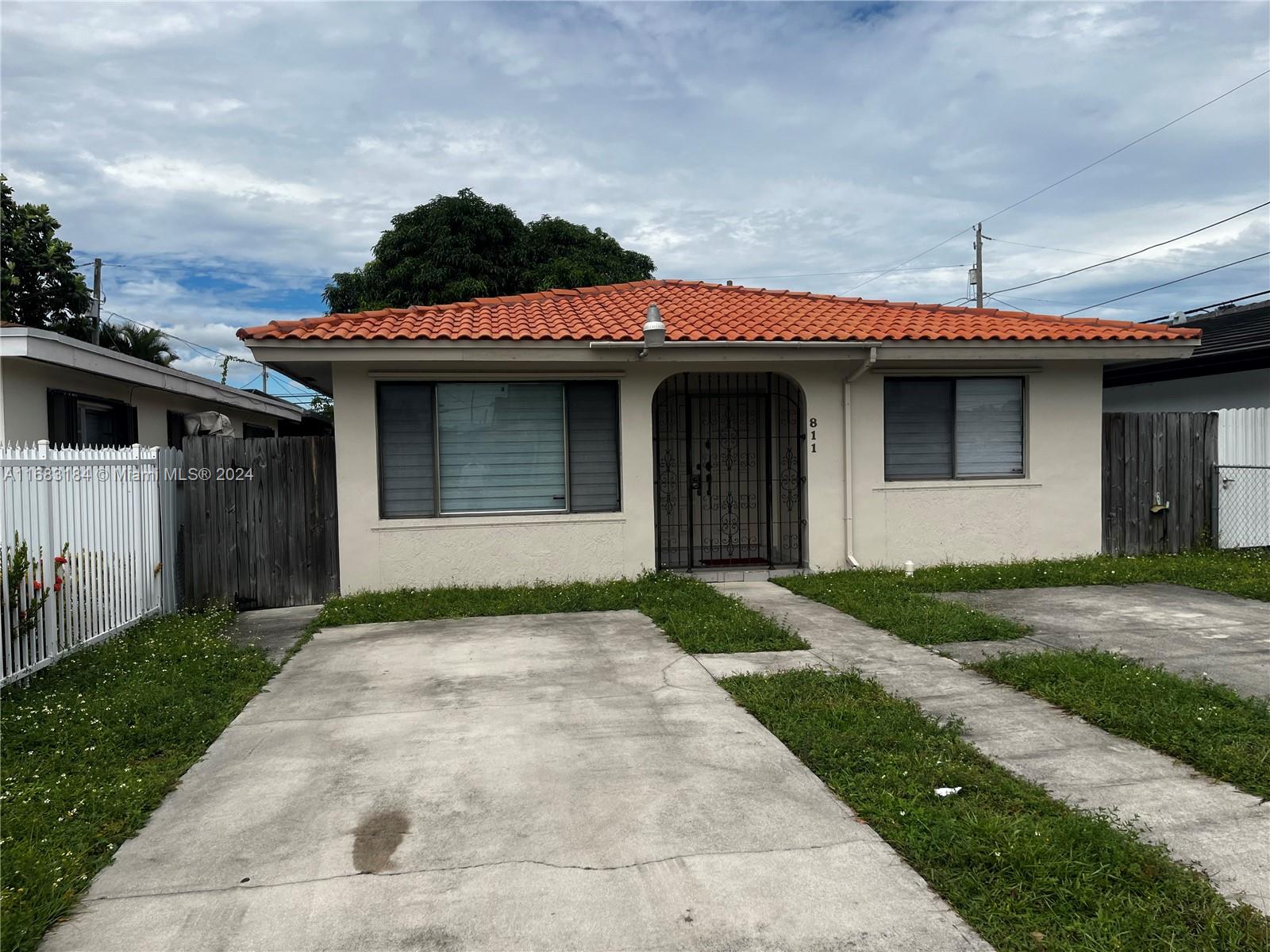 a front view of a house with garage