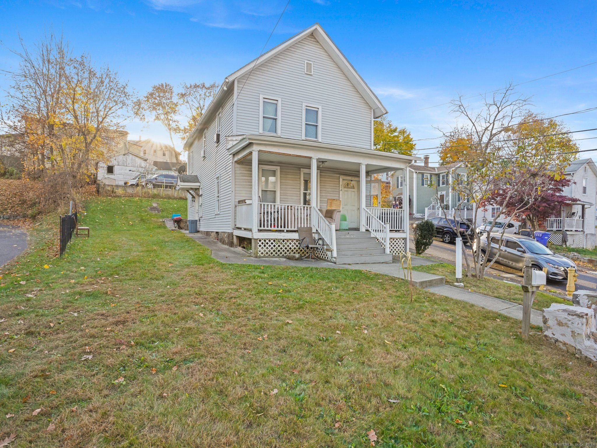 a view of a house with a yard porch and sitting area