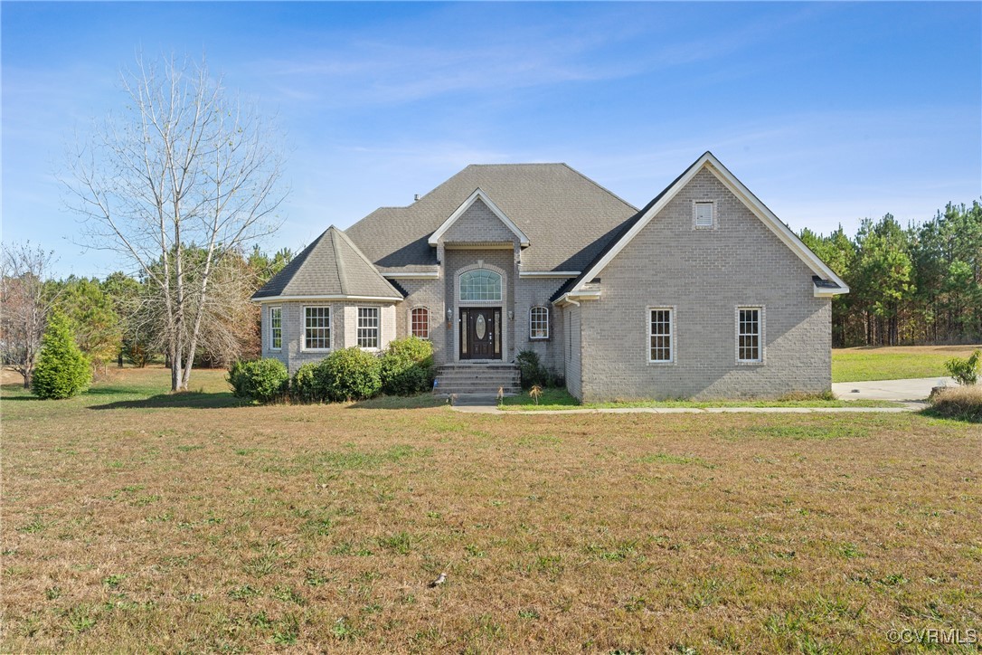 a front view of a house with a yard