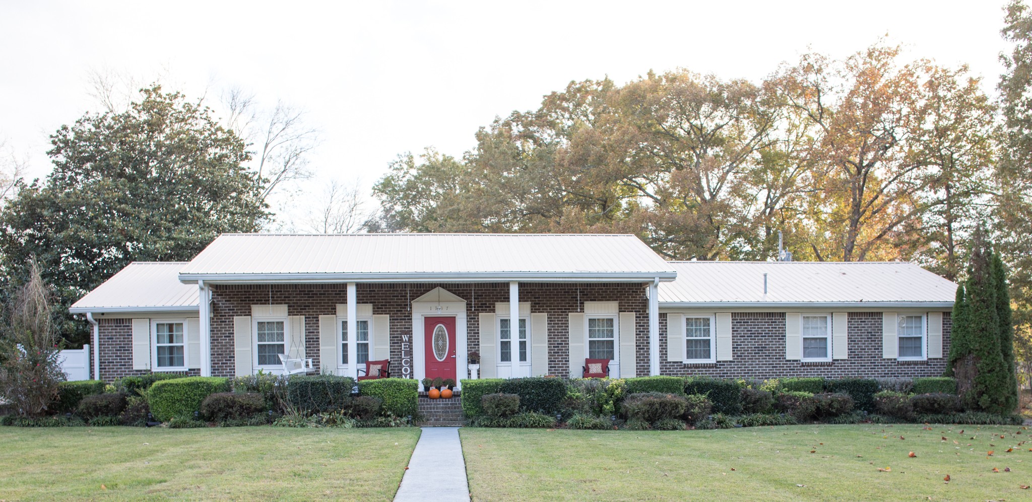 a front view of a house with a yard