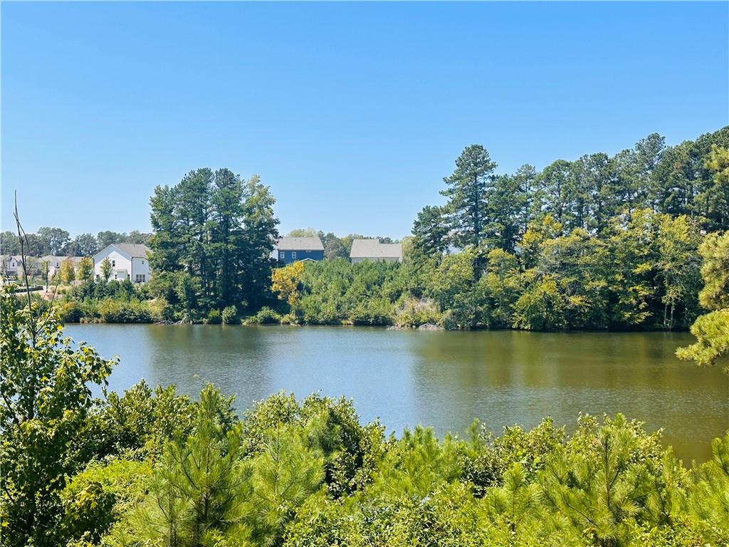 an aerial view of a houses with a lake view