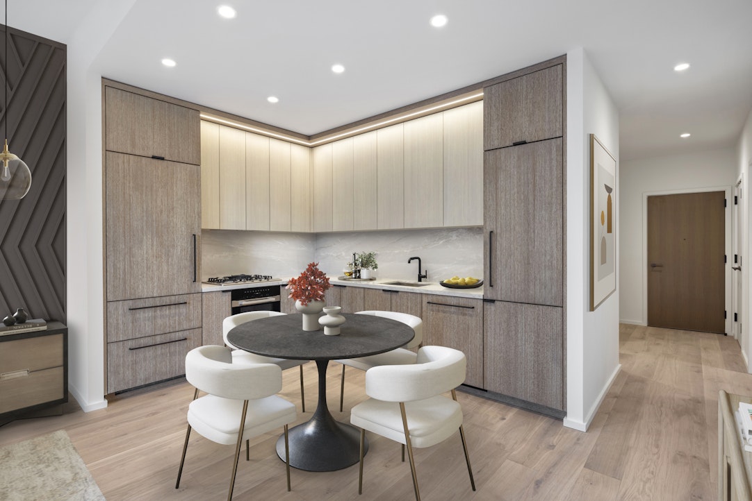 a kitchen with kitchen island a refrigerator and a stove