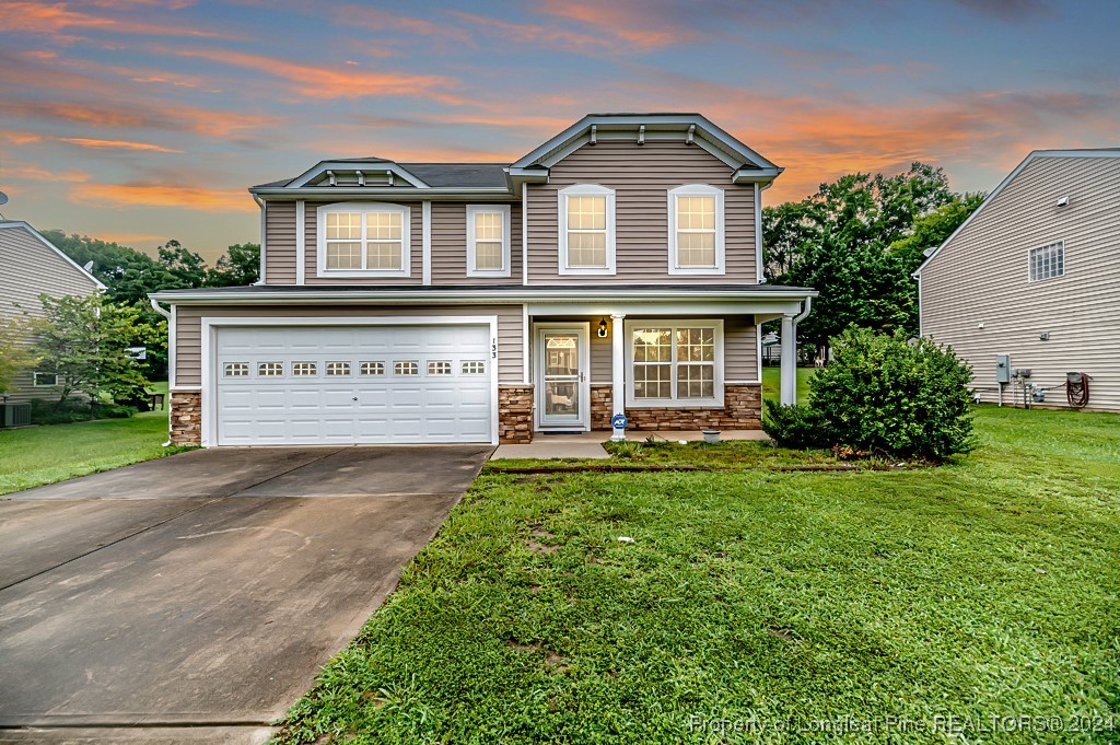 front view of a house with a yard