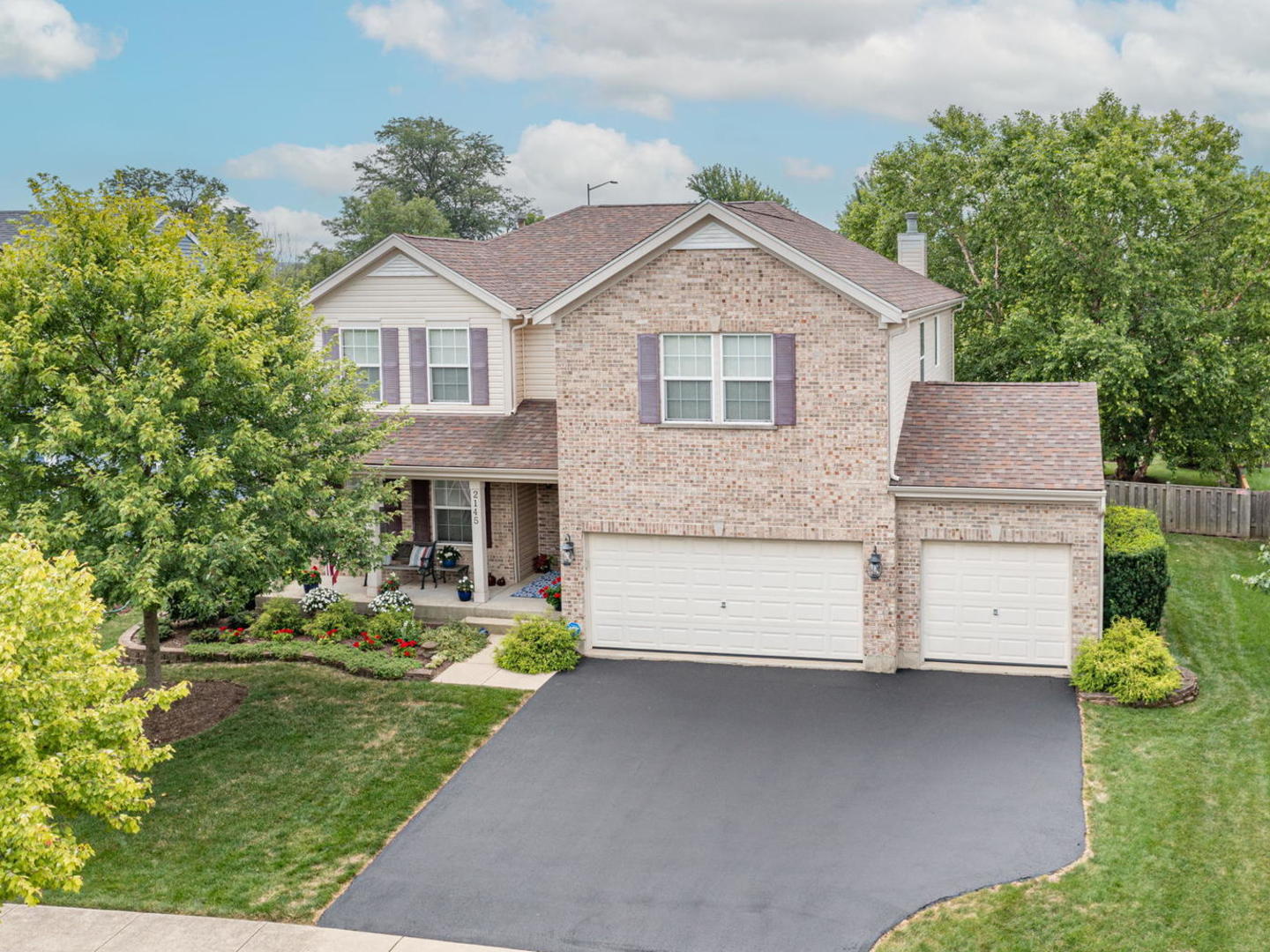 a aerial view of a house with a yard