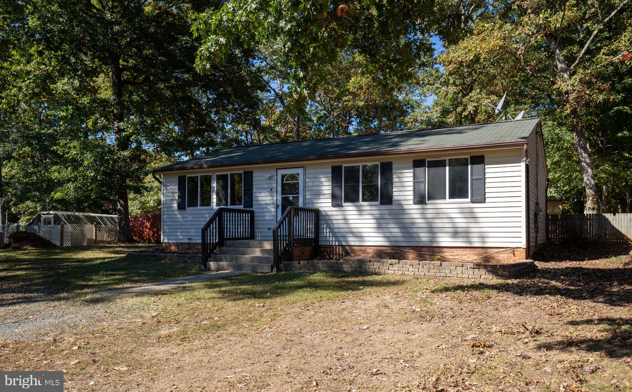 a front view of a house with yard