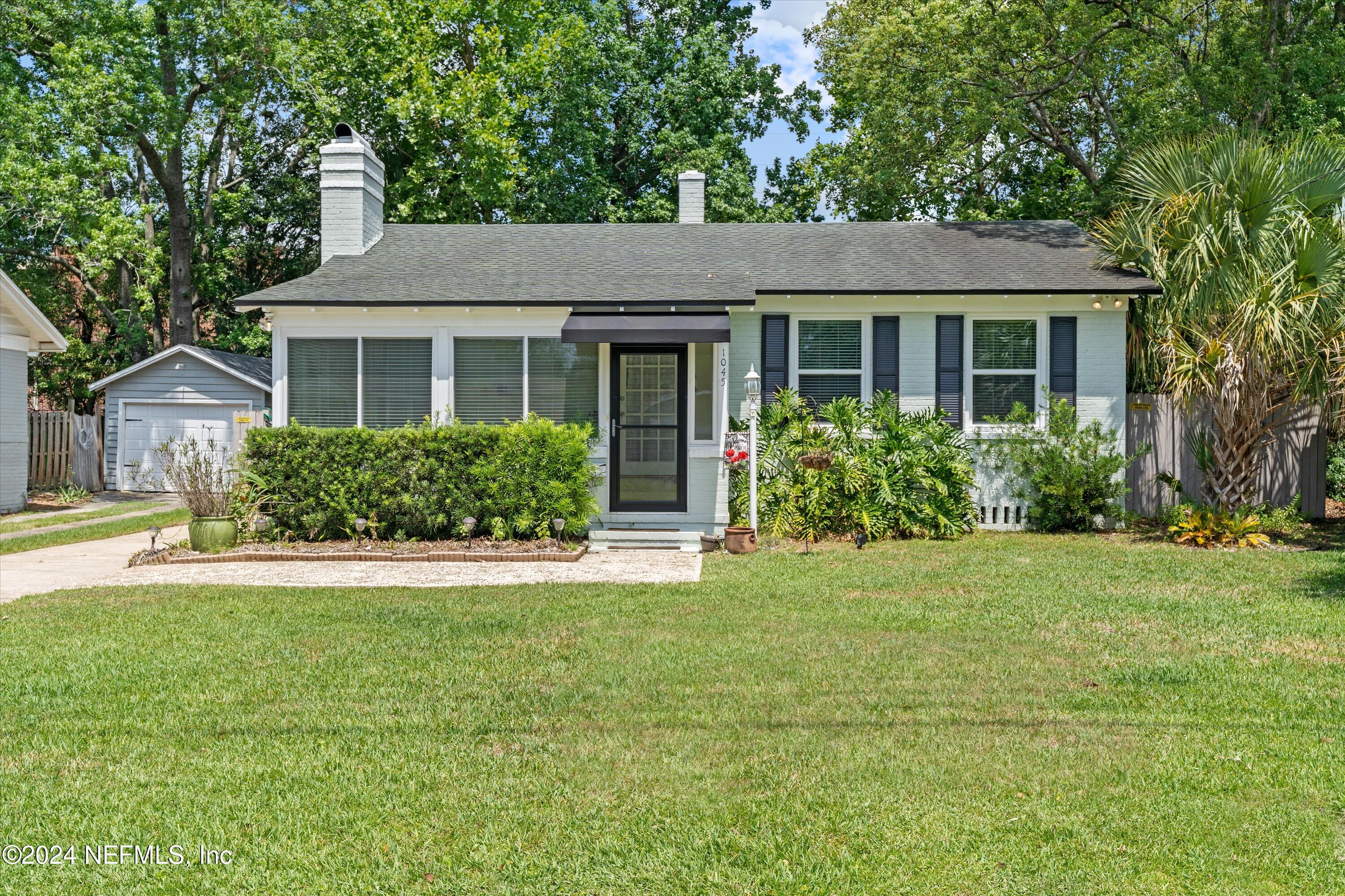 front view of a house with a yard