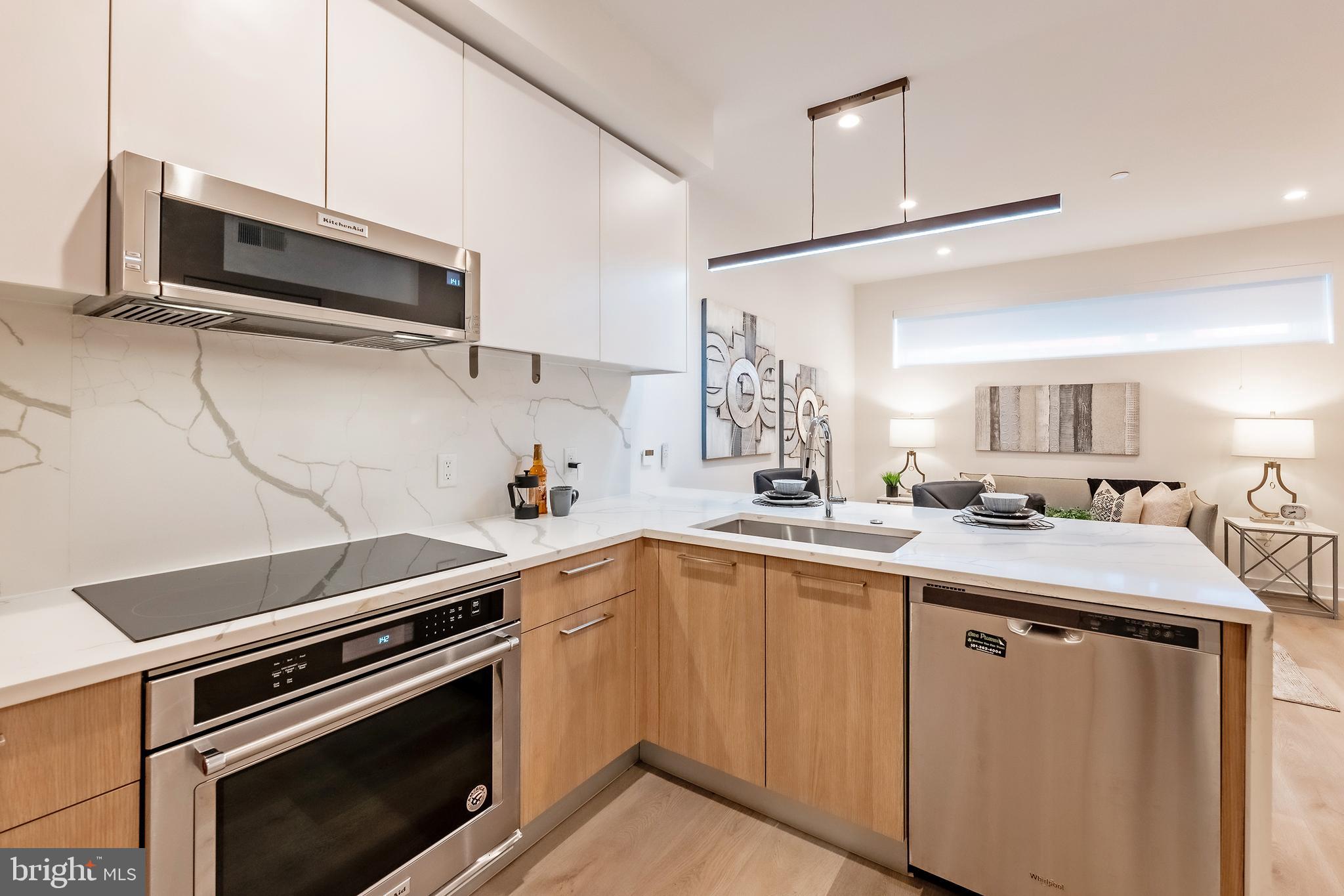 a kitchen with appliances cabinets and a sink