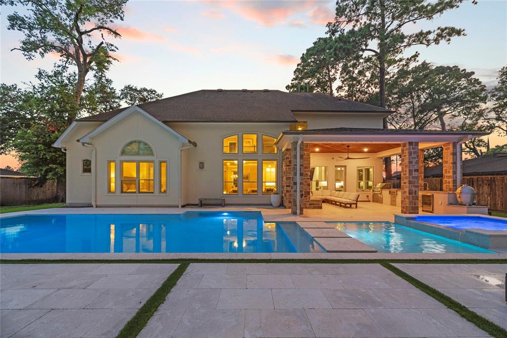 a view of swimming pool with an outdoor seating