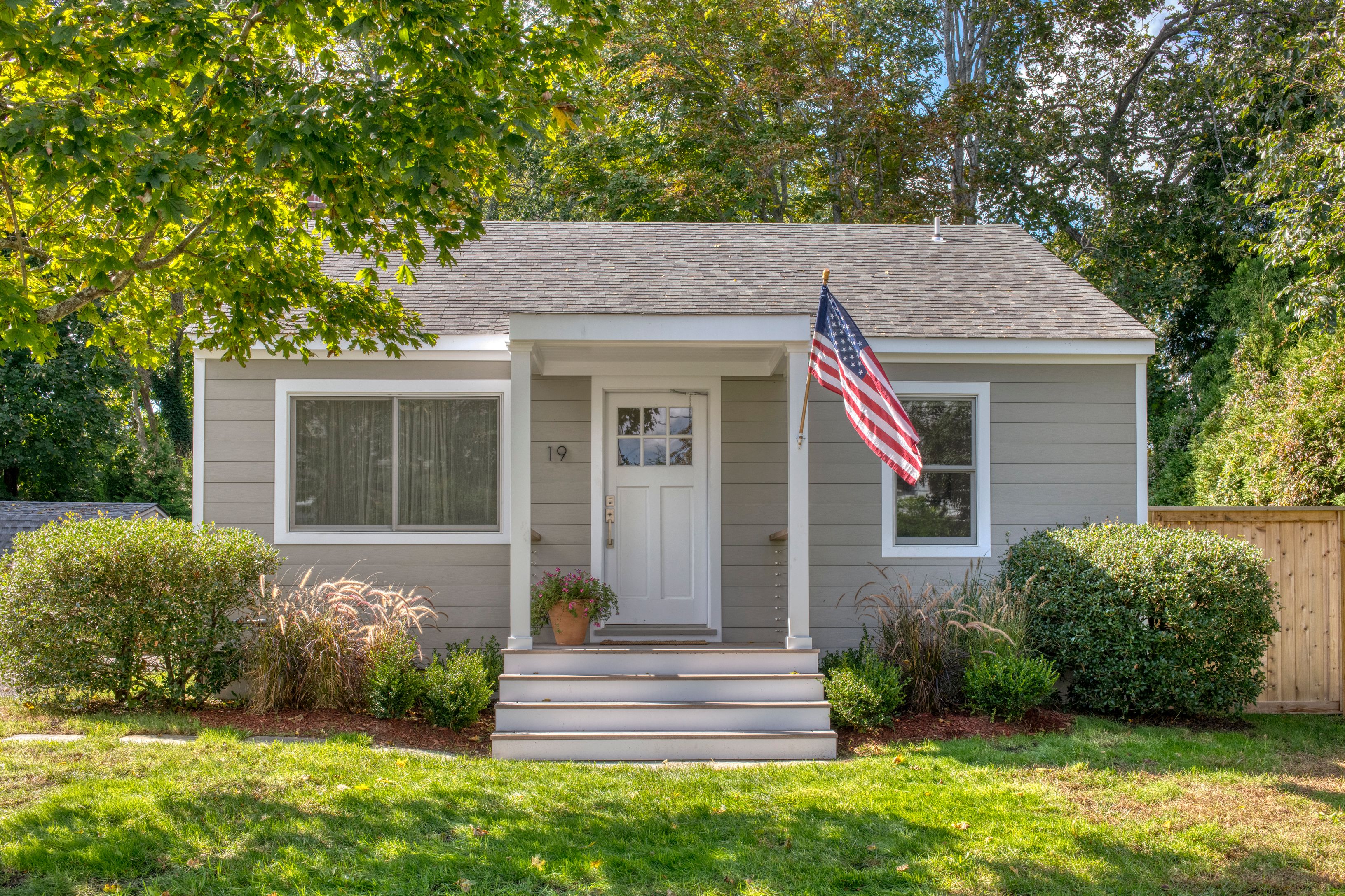 a front view of a house with garden