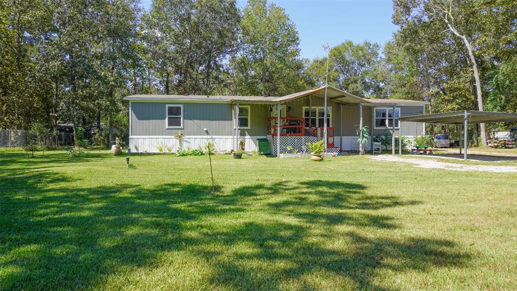 a view of a house with a big yard