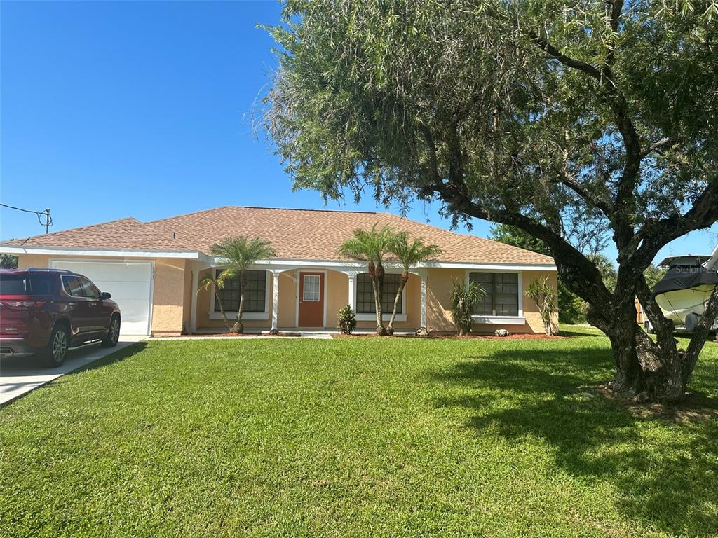 a view of a house with a yard