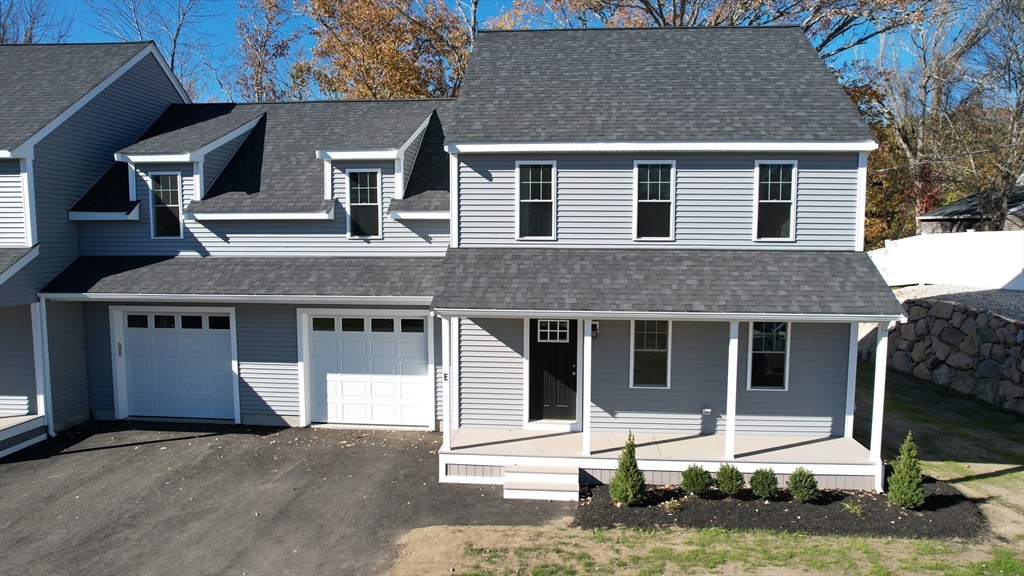 a front view of a house with a garage