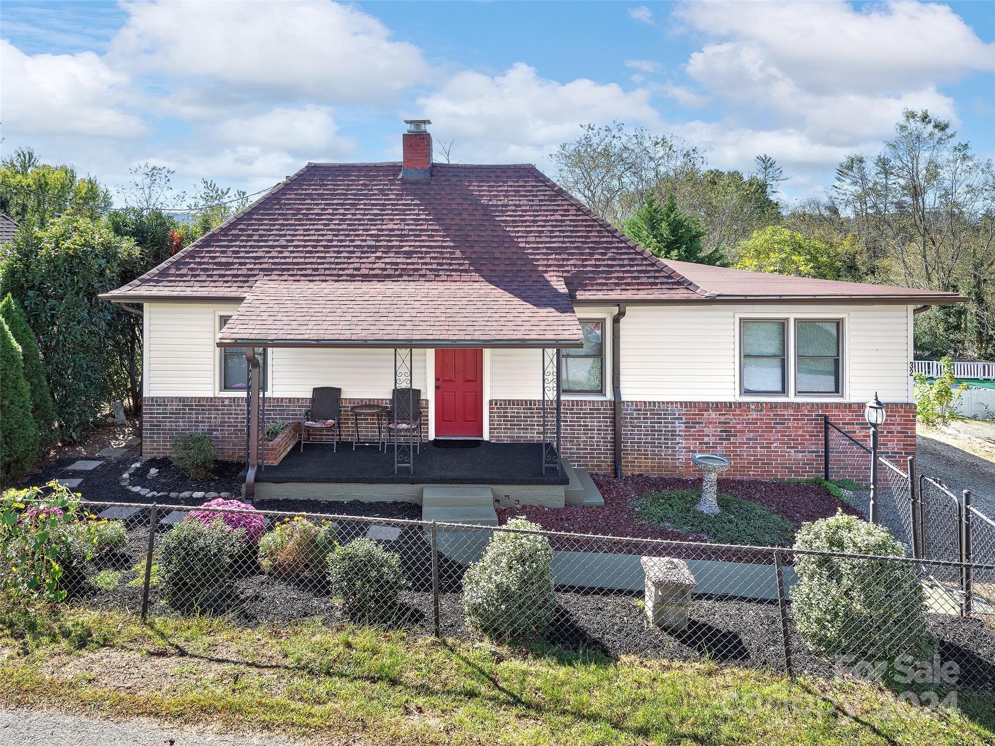 a front view of a house with garden