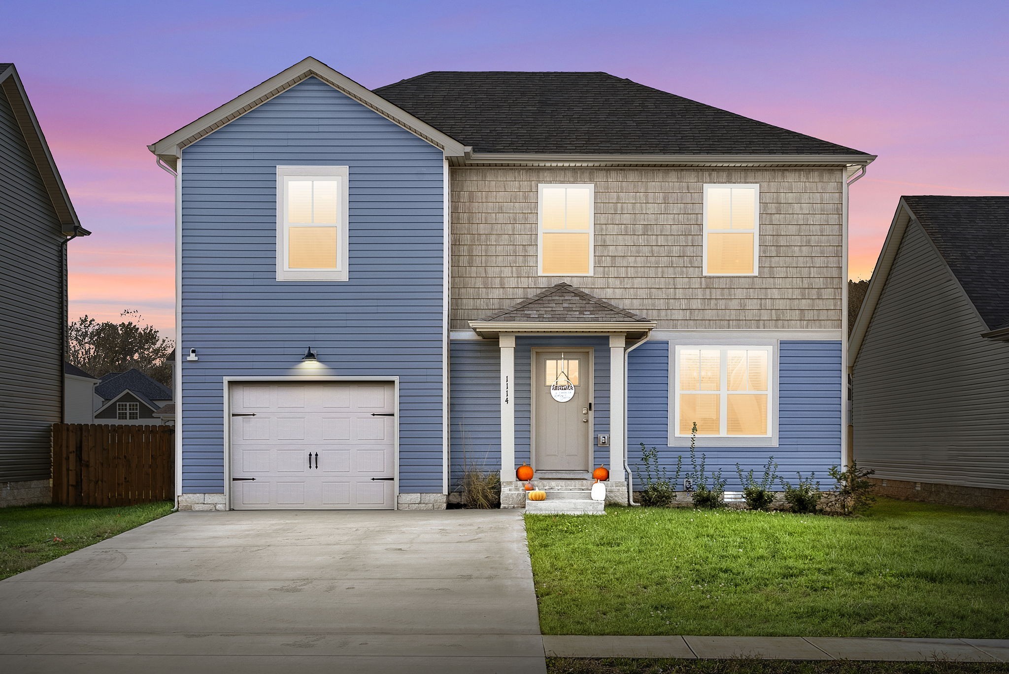 a front view of a house with a yard