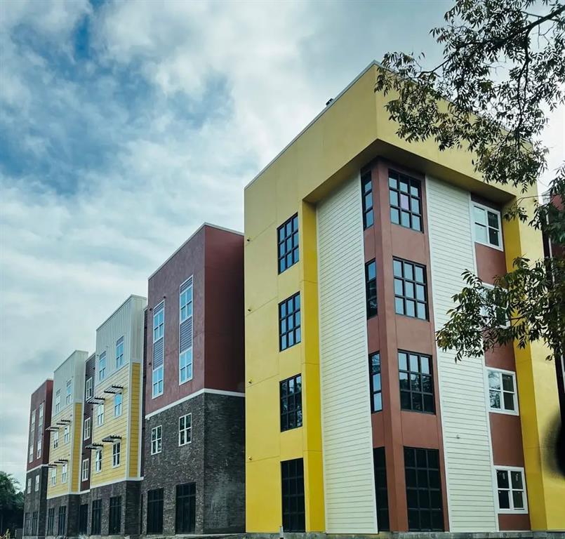 a front view of a multi story residential apartment building