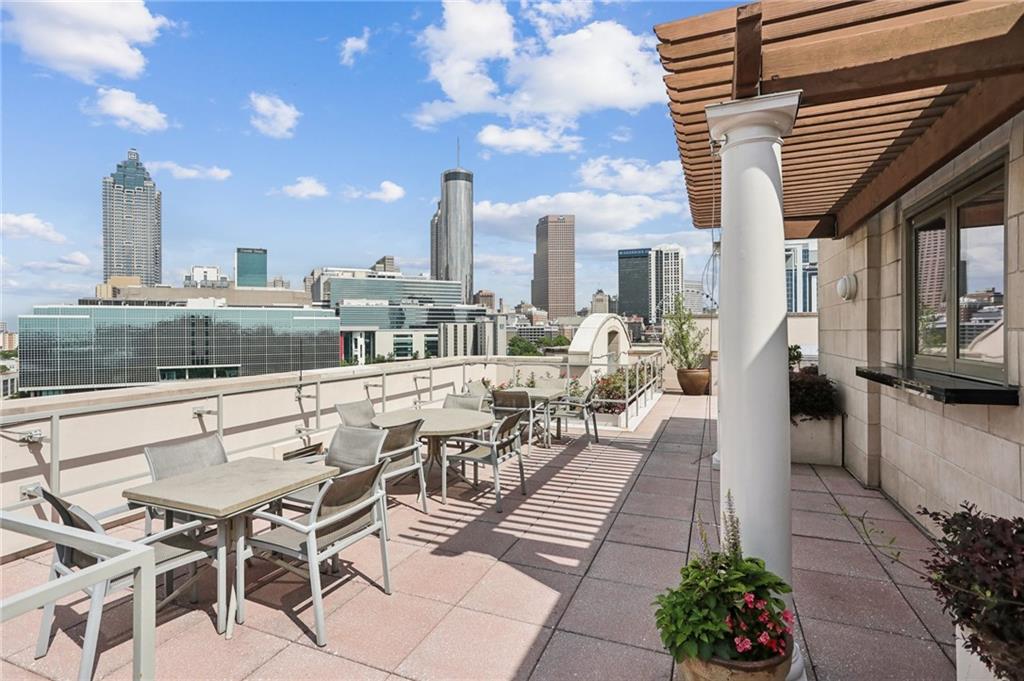 a view of a terrace with seating area and furniture