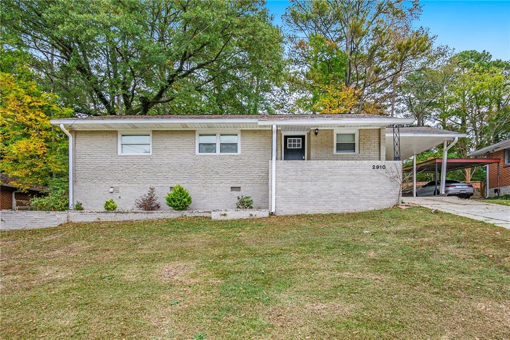 front view of a house with a yard