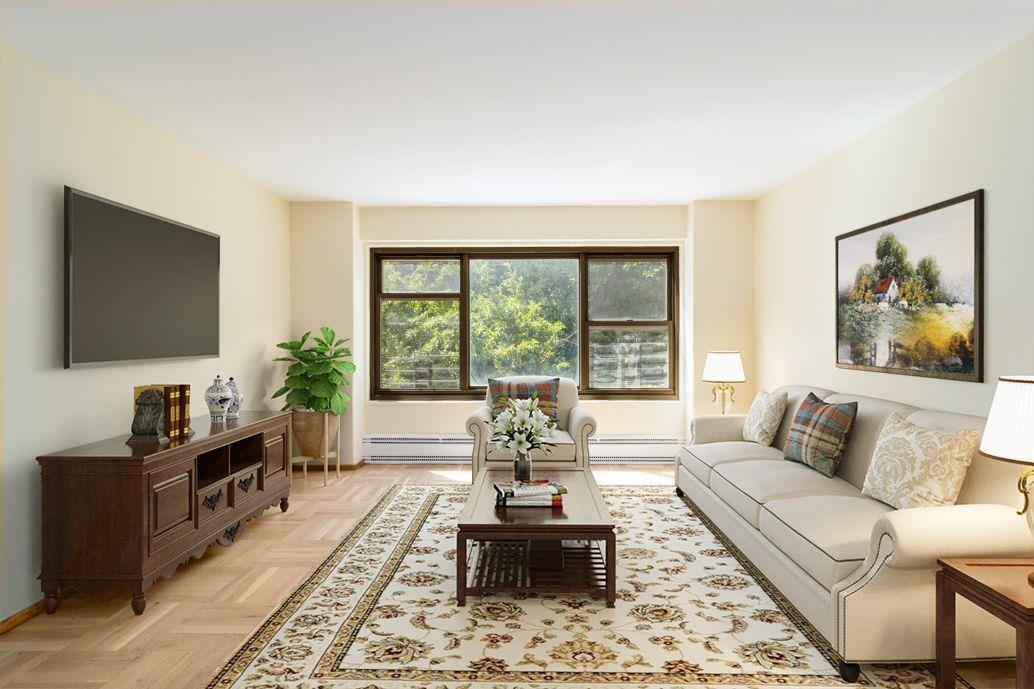 a living room with furniture large window and a flat screen tv