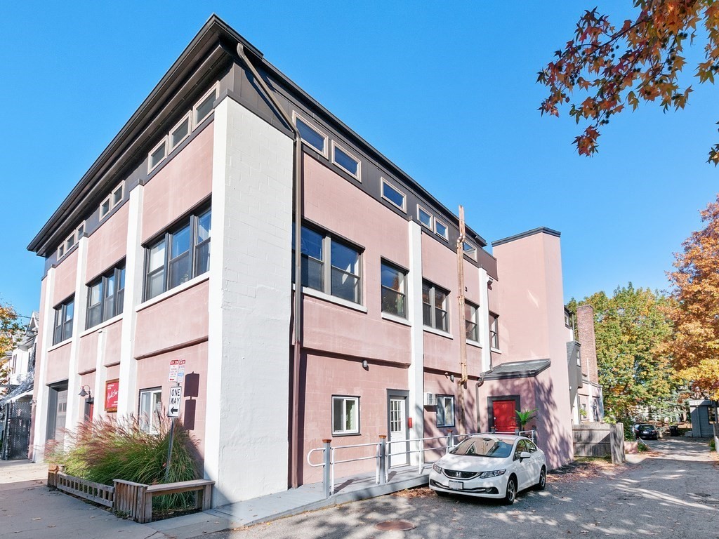 a car parked in front of a building