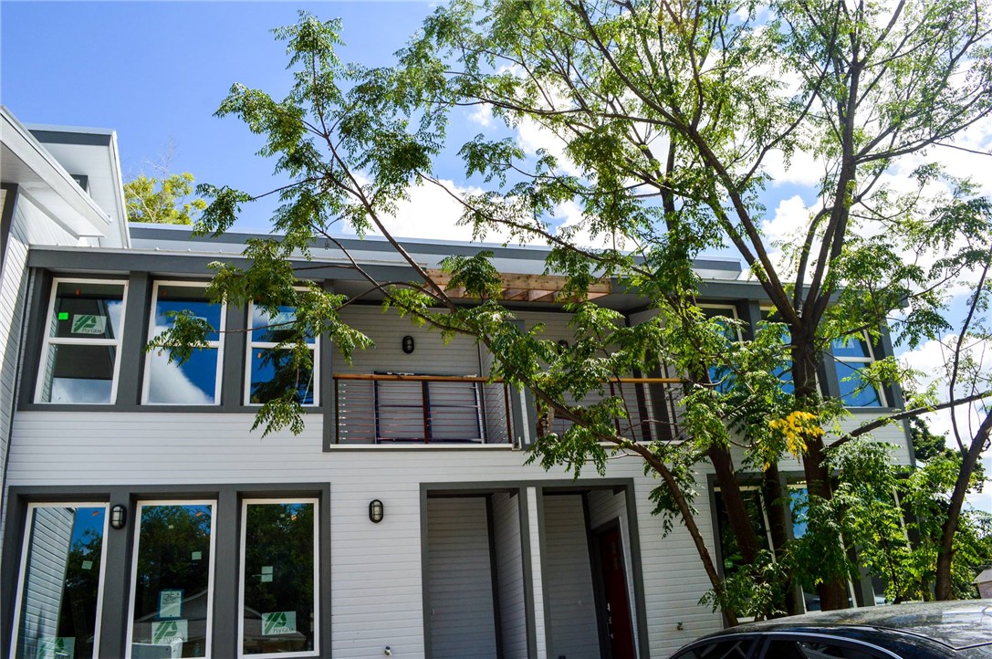 front view of house with a tree