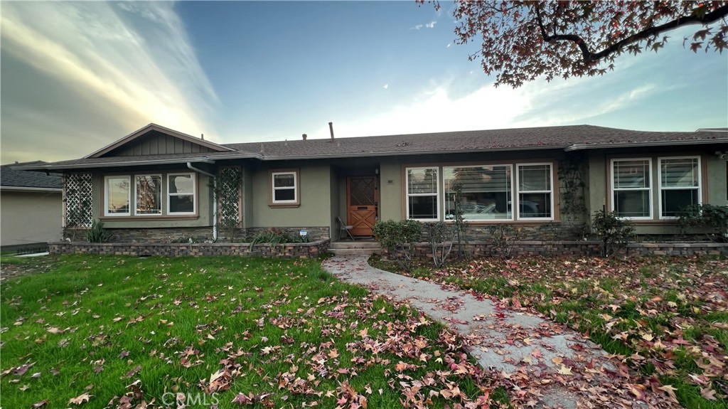 a front view of a house with garden