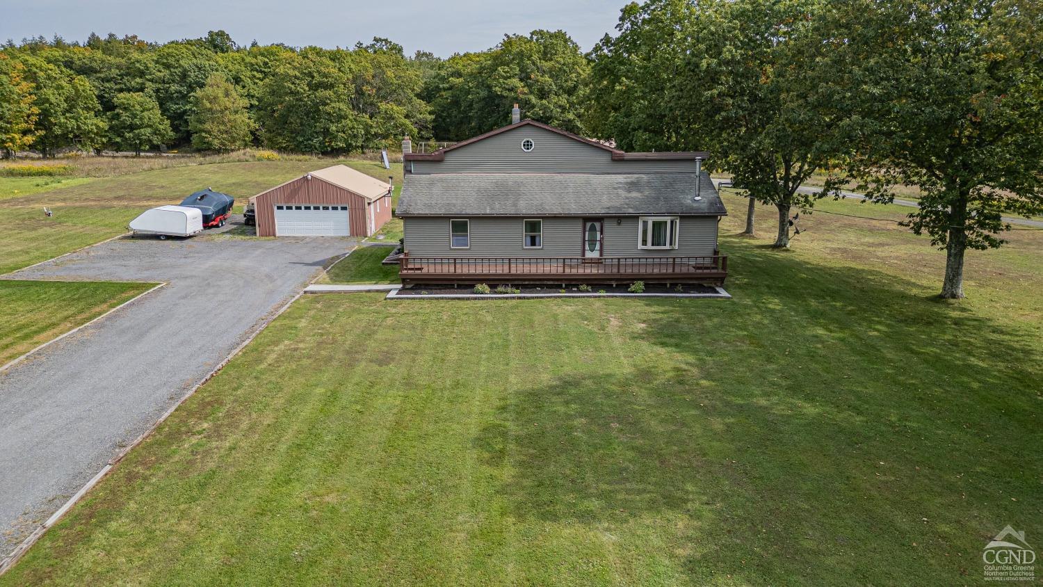 a view of a house with a big yard