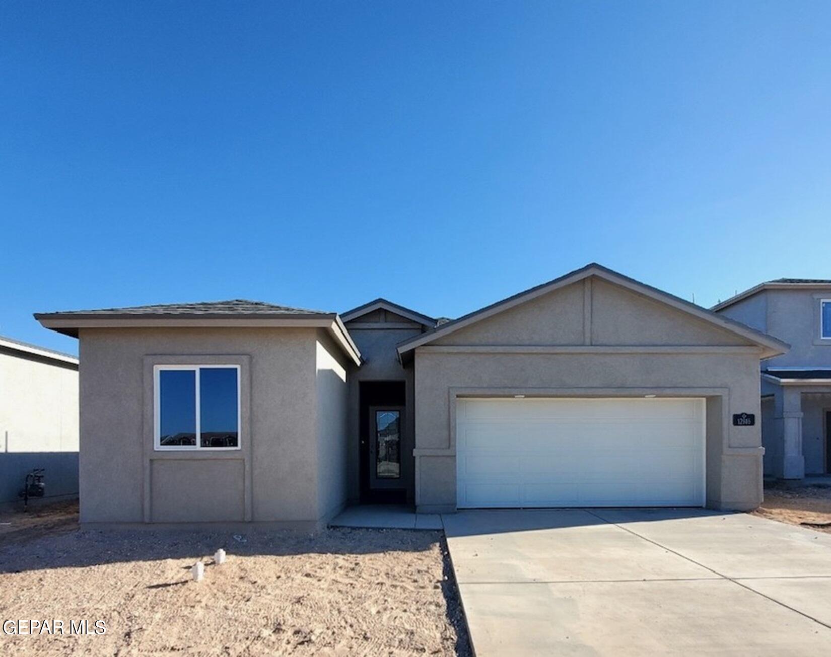 a front view of a house with a garage