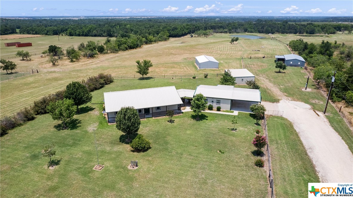 an aerial view of a house with outdoor space