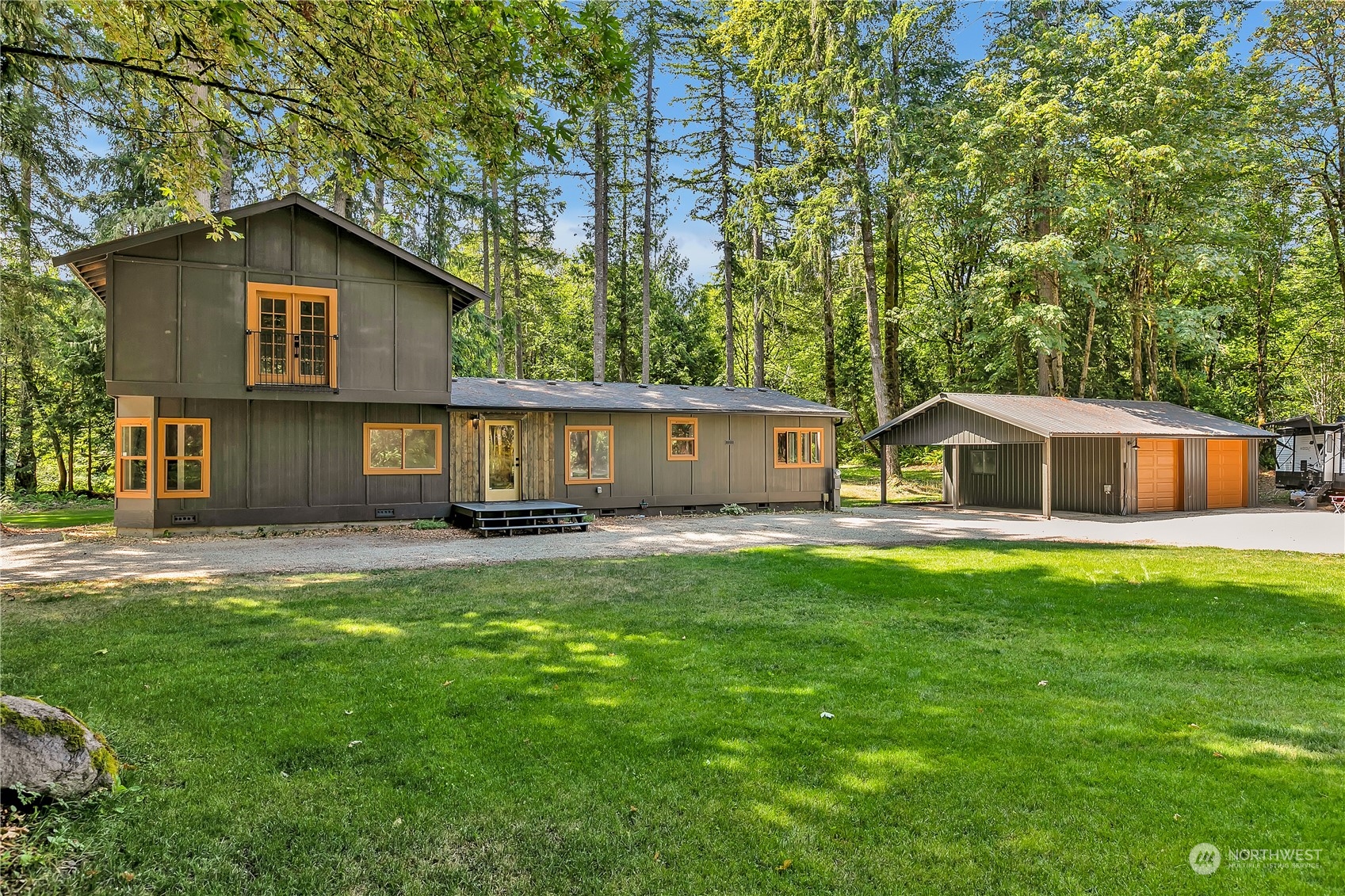 a front view of a house with yard and seating area