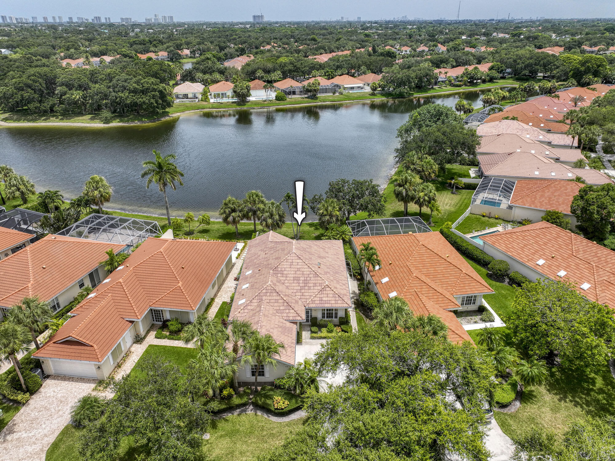 an aerial view of residential houses with outdoor space and river view