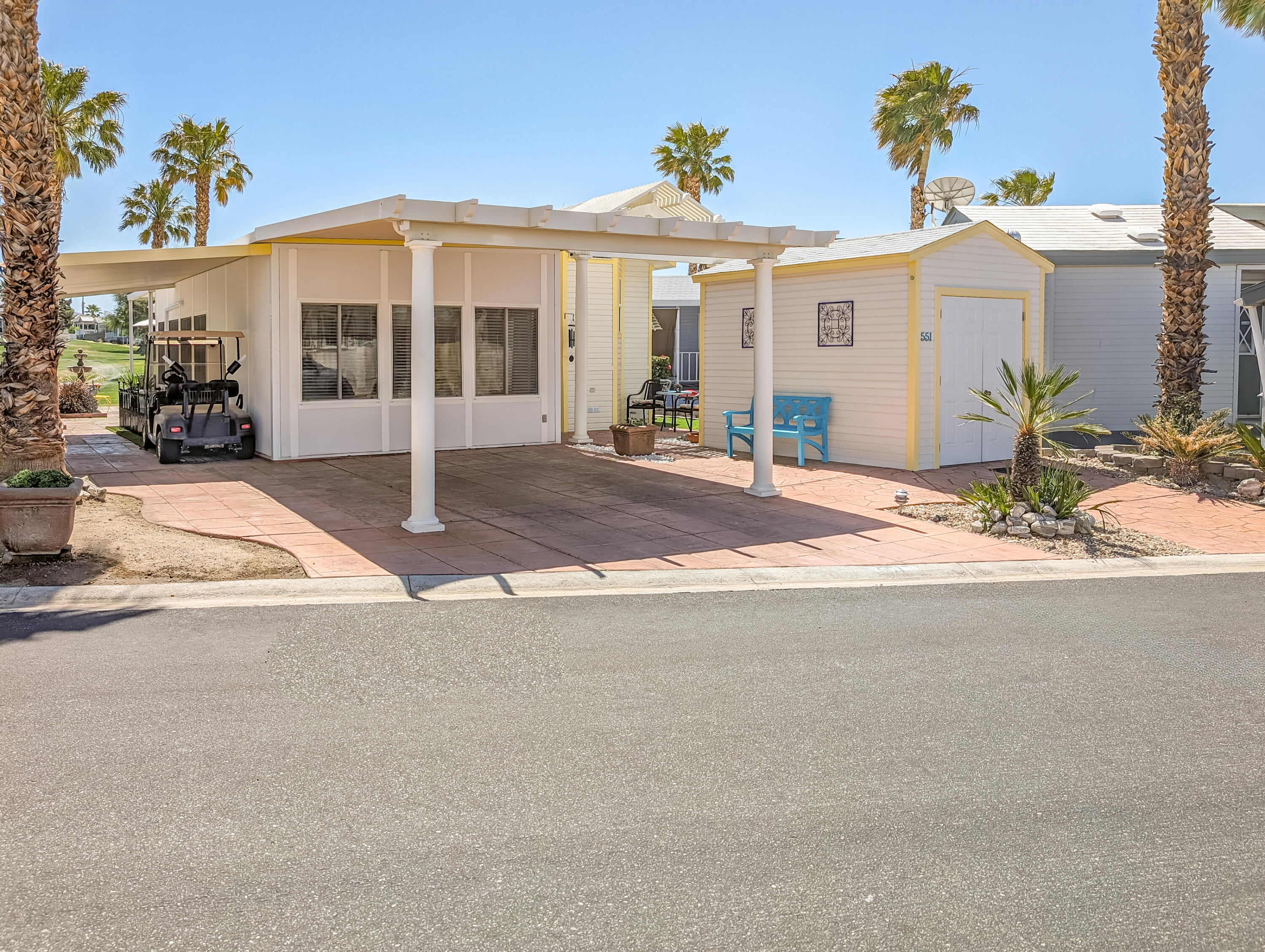 a front view of a house with a yard and a garage