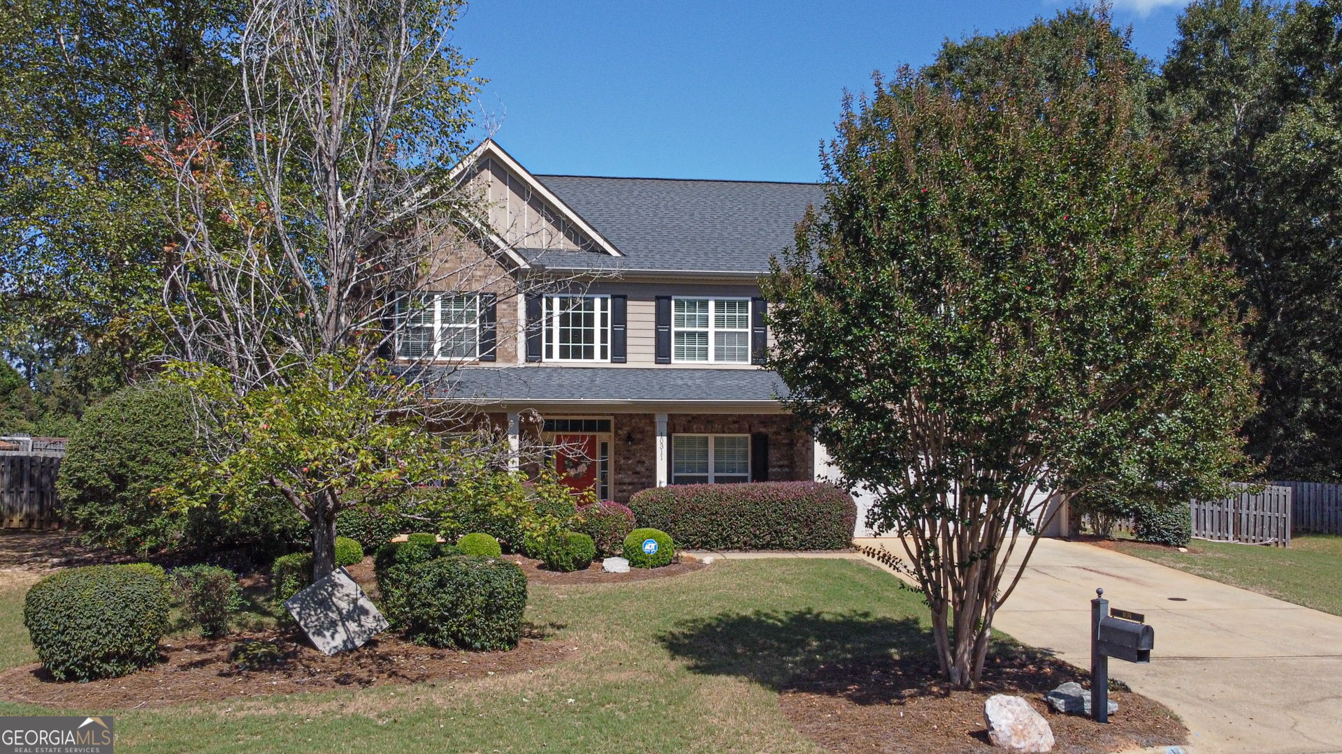 a front view of a house with a yard