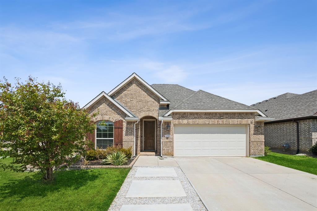 front view of a house with a yard